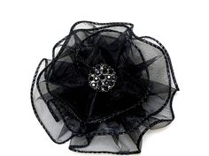 "Hand sewn magnetic black flower brooch attaches to clothing, hats and wraps without leaving a mark! The magnet can also be worn in the hair. The elegant black flower is 4 inches diameter and hand sewn from a wired sheer black ribbon. YOU CHOOSE from 5 choices of unique centerpieces. Pic. 1-Black Rhinestones (.75\") Pic.2- Faceted Oval (1\" L\") Pic.3- Vintage Filagree Button (.75\") Pic.4- Rhinestone Flower ) (1\") Ships gift wrapped in an organza bag To see my entire line of MAGNETIC BROOCHES Magnetic Brooch, Scarf Pins, Fancy Ribbon, Fabric Flower Brooch, Brooch Diy, Unique Centerpieces, Scarf Pin, Annual Meeting, Beautiful Bouquet Of Flowers