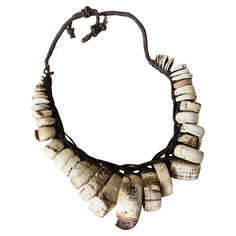 a necklace made out of bone beads