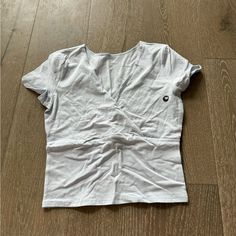 This Cute Tee From Hollister Features Short Sleeves, A V-Neckline And Slightly Cropped Length. New Without Tags Size Medium Hollister Tops, Baby Tee, Cute Tops, Infant Tees, Blue Gray, Hollister, Blue Grey, Color Blue, Short Sleeves