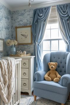 a teddy bear sitting in a blue chair next to a baby's crib