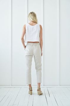 "Refresh your wardrobe with these lightweight, breezy trousers, and make them your casual go-to piece. Drawstring pants provide comfort and give laidback look. FABRIC: 100% softened Lithuanian linen COLOR: Please choose the desired color from the side menu. STYLE: Cropped linen pants with rubber all around the waist, and drawstring front. Has comfy side pockets. SIZE CHART: S Bust 31.5- 35\" (80- 88 cm) Waist 23- 26.5\" (59- 68 cm) Hips 35- 38\" (88- 96 cm) M Bust 35- 38\" (89- 96 cm) Waist 27- Cropped White Bottoms With Pockets, Spring Cropped Loungewear Pants, Cropped Pants For Spring Loungewear, Casual Beige Cropped Bottoms, Cropped Loungewear Pants For Spring, Relaxed Fit Linen Cropped Bottoms, Relaxed Fit Cropped Linen Bottoms, Spring Cropped Bottoms With Loosely Fitted Hips, Linen Capris For Loungewear