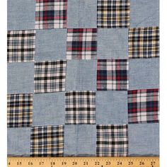 a blue and white patchwork quilt with plaid squares on the front, in different colors