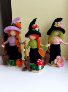 three little dolls are dressed up as witches