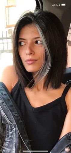 Grey Front Streak Hair, Silver Streak In Front Of Hair, Dark Hair Grey Streak, Hair Color Ideas For Black Hair Going Grey, Natural Grey Streaks In Dark Hair, Black Hair Gray Streak, Grey Streaked Hair, Dark Hair With Grey Streak, Grey Streak In Hair