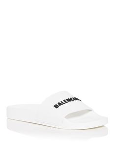 Balenciaga Women's Logo Slide Sandals Designer Slides For Beach And Spring, Designer Slides For Spring Beach Outing, Classic White Sandals For Vacation, Chic White Flat Slides, Designer White Sandals For Summer, Elegant White Slides For Beach, Chic White Slides For Summer, Designer White Slides For Beach, Designer White Beach Slides