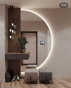 a modern bathroom with an oval mirror and stools