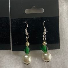 This unique pair of earrings is the perfect gift for any occasion. The vibrant green colors combined with the leaf-shaped bead cap give this pair a nature-y feel that you are sure to love. There is only one in stock, so buy soon! All findings are nickel-free, beads were thrifted, and materials were purchased at respectable stores. Pearl beads are faux. Thank you for shopping with us! If you like what we make, follow us over on Instagram @halcyon_delights Green Teardrop Clip-on Earrings, Elegant Green Flower Earrings Nickel Free, Elegant Handmade Green Flower Earrings, Hypoallergenic Green Jewelry For Parties, Green Teardrop Beaded Earrings For Party, Handmade Green Pearl Earrings For Gift, Elegant Handmade Green Beaded Earrings, Elegant Green Beaded Drop Earrings, Green Beaded Earrings With Round Beads