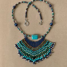 a necklace and earring set with turquoise beads