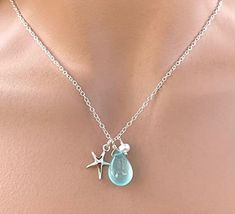 A beautiful necklace featuring:    - a sterling silver starfish charm  - a smooth aqua blue chalcedony gemstone   - a small freshwater pear.  - a Sterling Silver chain measuring 18 inches long with a spring clasp.  Very popular as a fashion accessory. All metals used are sterling silver.  Your new jewelry will arrive nicely gift boxed. Handmade in the USA Aqua Jewelry, Pearl Charm Necklace, Color Aqua, White Freshwater Pearl, Pearl Charms, Blue Chalcedony, Blue Gemstones, Beautiful Necklace, Aqua Blue