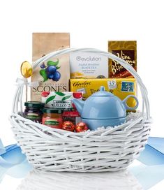 a white basket filled with tea and snacks