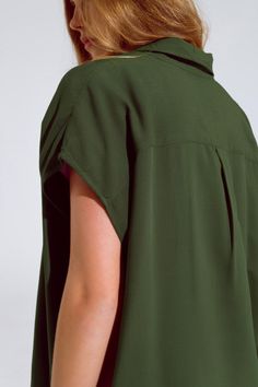 Subcategory: Blouse. Neck: Polo collar. Sleeves: Short Sleeves. Fit: Standard fit. Style: Daily. Detail: Button detail. Fabric: Lightweight woven fabric . runs true to size. S. 100% Viscose Green Short Sleeve Office Blouse, Green Short Sleeve Blouse For Office, Green Short Sleeve Top With Placket, Green Collared Top For Office, Green Relaxed Fit Top With Collared Neckline, Green Relaxed Fit Collared Top, Relaxed Fit Green Top With Collared Neckline, Green Button-up Top For Office, Green Button-up Office Tops