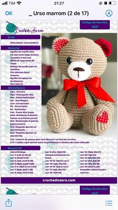 a crocheted teddy bear with a red bow