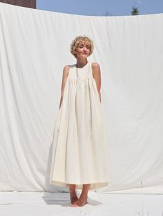 Dress is made in mid-weight pre-washed pure linen. Loose and extremely comfortable fit. Elegant and feminine look, perfect dress for a special occasion or everyday wear.

• Handmade in our studio
• A-line silhouette
• Sleeveless bodice
• Elasticated low back and wide tie straps
• Hidden side seam pockets
• Available from XXS to XXL size or can be made in a custom size Cream Sleeveless Linen Dress, Sleeveless Cream Linen Dress, Cream Linen Sleeveless Dress, Sleeveless Sundress For Gatherings, Low Back Dress, Silhouette Dress, Low Back Dresses, Dress Silhouette, Feminine Look