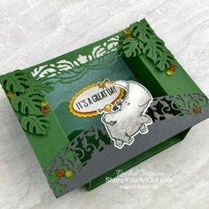 a green box with an elephant on it