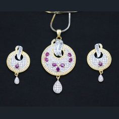 Indian Designer Red Ruby CZ White Pendant Earrings Women Fashion Traditional Party Wear Wedding Jewelry This is a set of beautiful Pendant Earrings studded with high-quality CZ Stones. (Indian Pendant, Bollywood Pendant, Asian Pendant, Traditional Pendant, Ethnic Pendant, Designer Pendant, Fashion Pendant, Wedding Pendant, Bridal Pendant) ITEM DESCRIPTION Metal = Gold Plated Occasion = Wedding ,Party Wear, Bridal Color = White and Red Size = Pendant Size - 2 Inches, Earrings Size - 1 Inches, Cha Party Jewelry Sets With American Diamond And Round Shape, Red Hand Set Earrings For Party, Red Cubic Zirconia Jewelry Sets For Festive Occasions, Hand Set Red Earrings For Party, White American Diamond Party Jewelry Set, White Ruby Jewelry Sets For Gift, White American Diamond Jewelry Set For Party, Red Cubic Zirconia Jewelry Sets For Celebration, Ruby Jewelry Sets For Celebration