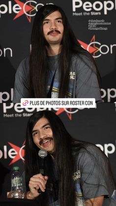 a man with long hair holding a microphone in front of a sign that says people