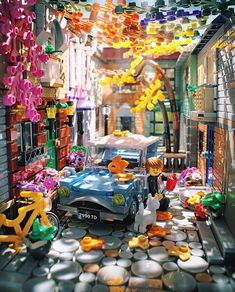 a toy car is parked in the middle of a room filled with toys and decorations