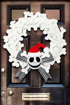 a door decorated with marshmallows and a santa's hat on it