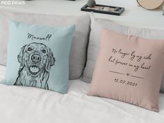 two pillows on a bed with a drawing of a dog and the words memorial written on them