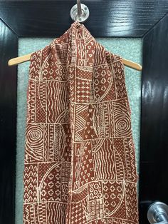 A beautiful hand woven brown and white  Mudcloth scarf . The Mudcloth is imported from Mali.  This is  great for layering . It is 12 inches wide and 62 inches long . This is unisex and is great as a gift item. It is a rare find . Please visit evelyncreationinc@etsy.com for more items . Don't delay order yours today. Traditional Brown Shawl With Patterns, Beige Bohemian Dupatta With Traditional Patterns, Brown Traditional Patterned Scarves, Brown Shawl Dupatta With Traditional Patterns, Brown Dupatta With Traditional Patterns Shawl, Brown Dupatta With Traditional Patterns In Shawl Shape, Traditional Brown Shawl With Woven Motifs, Traditional Brown Cotton Scarf, Traditional Brown Handloom Dupatta