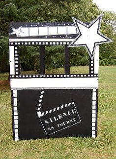 a black and white sign with a star on it that says science on display in front of some trees