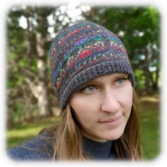 a woman wearing a knitted hat in the park