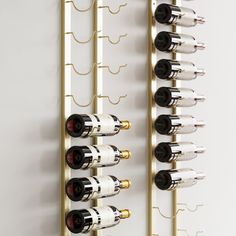 the wine rack is made from brass and holds several bottles, which are lined up in rows