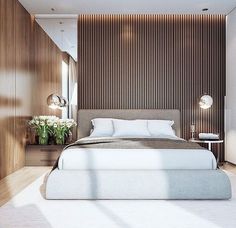 a large bed sitting in the middle of a bedroom next to a wall with wooden slats