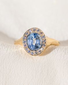 *One of a Kind* hand-carved 14k Yellow Gold ring, set with a stunning oval Sri Lankan Lavender Sapphire, surrounded by a halo of White Diamonds. Center Sapphire is approx. 7 x 6mm and 1.65 ct. 💌 Please write desired size (between 4-8) in *Notes* section at checkout. * Lavender Sapphire from Sri Lanka, is a stone of deep awakening, stimulating the rise of the kundalini transformation energy, while opening your connection with your spirituality. Opening the third eye and crown chakras, it imparts Luxury Purple Halo Rings, Luxury Lavender Ring, Luxury Halo Design Jewelry With Lab-created Sapphire, Luxury Blue Lab-created Sapphire Halo Ring, Luxury Lavender Amethyst Ring - Fine Jewelry, Lavender Sapphire, Sapphire Halo Ring, Beacon Of Light, Yellow Gold Ring