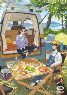 two people sitting at a picnic table in front of a van