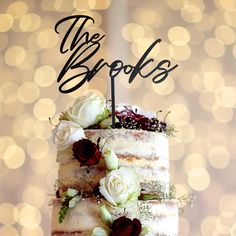 a wedding cake with flowers and the words the brooks on top