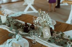 the table is set for an elegant wedding reception