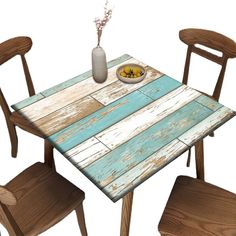 a wooden table with two chairs and a bowl of food on top of the table