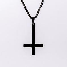 "Experience the allure and power of our gothic-inspired upside down cross necklace, crafted with sturdy black alloy steel. This must-have accessory comes with a sleek 20-inch double-linked black chain, ensuring longevity and offering incredible value. Don't miss out on this one-of-a-kind piece!" Gothic Black Crucifix Cross Necklace, Minimalist Black Cross Pendant Necklace, Gothic Stainless Steel Cross Pendant Jewelry, Ankh Shaped Black Metal Necklace, Gothic Black Cross Pendant Necklace, Minimalist Black Cross Jewelry, Black Ankh Necklace In Metal, Gothic Black Cross Necklace Gift, Gothic Black Metal Cross Necklace