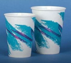 two white cups with blue and purple designs on them