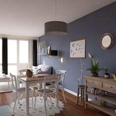 a living room with blue walls and white furniture in the center, along with a dining table