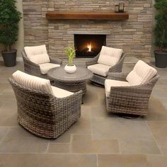 a living room with wicker furniture and a fire place