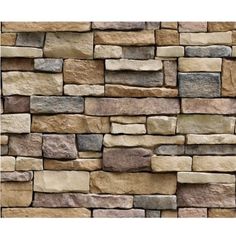 a stone wall that is made out of several different types of stones and has various colors