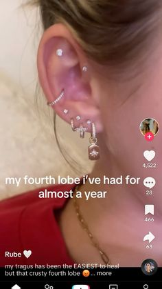 a woman wearing ear piercings with the caption my fourth lob i've had for almost a year