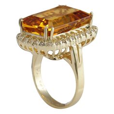 Stamped: 14K Yellow Gold Total Ring Weight: 8.0 Grams Ring Length: N/A Ring Width: N/A Gemstone Weight: Total Natural Citrine Weight is 15.71 Carat (Measures: 18.35x12.95 mm) Color: Yellow Diamond Weight: Total Natural Diamond Weight is 0.90 Carat Quantity: 30 Color: F-G, Clarity: VS2-SI1 Face Measures: 23.12x15.93 mm Sku: [703025W] Formal Octagon Rings With Gemstone Accents, Formal Yellow Octagon Ring, Formal Yellow Rings With Gemstone Accents, Yellow Rings With Gemstone Accents For Formal Occasions, Formal Citrine Diamond Ring With Prong Setting, Formal Orange Rings With Halo Setting, Yellow Gold Emerald Cut Gemstones For Formal Occasions, Emerald Cut Yellow Gold Gemstones For Formal Occasions, Emerald Cut Yellow Gold Gemstones For Formal Events