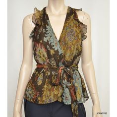 Lauren Ralph Lauren 'Catlyi' Sleeveless Printed Ruffled Blouse Lauren By Ralph Lauren's Breezy Silk Georgette Top Is Crafted With Feminine Cutout Shoulders And Delicate Ruffles. Size 2: Length - 22"; Width (Armpit To Armpit) - 17.5" Size 4: Length - 22.5"; Width (Armpit To Armpit) - 18" * Color: Brown/Multi * Wrap Construction * Crossover V-Neckline * Sleeveless Silhouette * Cutout Shoulders * Ruffles At The Armholes * Self-Ties At The Waist * Shell: 100% Silk * Lining: 100% Polyester * Dry Clea Multicolor Vest Blouse For Spring, Brown Silk Summer Tops, Brown Silk Tops For Spring, Brown Silk Top For Spring, Spring Brown Silk Top, Sleeveless Silk Top With Floral Print, Spring Brown Silk Blouse, Brown Silk Blouse For Spring, Sleeveless Floral Print Blouse For Work