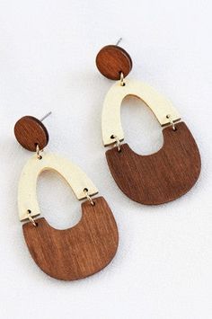 Elevate your look with our Reed's Wooden Teardrop Earrings! Handcrafted from lightweight wood, these bohemian-inspired earrings feature intricate laser cut details, adding unique charm to any outfit. Experience effortless style and all-day comfort with our dangle teardrop design. A must-have for every jewelry collection! Wooden Teardrop Earrings, Denim Chambray Dress, Comfort Gifts, Chain Lanyard, Chambray Dress, Boutique Tops, Accessories Jewelry Necklace, Elevate Your Look, Wallet Fashion