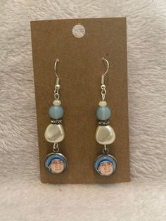 Mother Teresa Earrings. Choose from the drop down box which set you want.  Image taken from my original artwork. Handmade by me. Enjoy beautiful Catholic art jewelry bracelets with my original art or give them away as a great gift to inspire and delight.  Thanks for visiting my shop, if you need anything please don't hesitate to ask. Handmade Dangle Earrings For Mother's Day, Personalized Dangle Earrings For Gifts, Mother's Day Dangle Earrings Jewelry Set, Mother's Day Matching Dangle Earrings, Adjustable Personalized Earrings As Gift, Personalized Adjustable Earrings For Gift, Adjustable Artistic Hypoallergenic Jewelry, Spiritual Dangle Earrings As Gift, Artistic Drop Earrings With Matching Jewelry Set