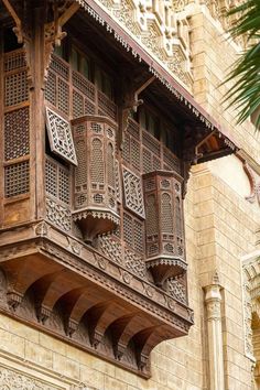 an old building with wooden balconies and intricate carvings