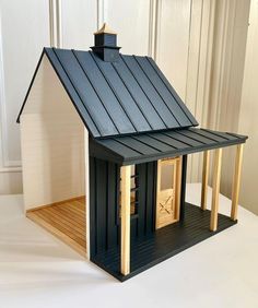 a small house made out of wood and metal