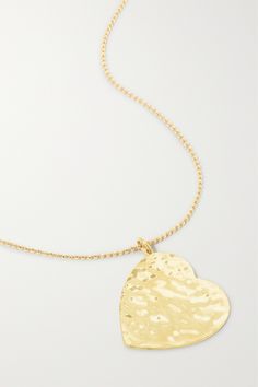 Jennifer Meyer's necklace is strung with a heart-shaped pendant, making it a perfect gift for a loved one. Handmade from 18-karat gold, it has a hammered finish that catches the light beautifully. Wear it alone or layered with similar styles. Luxury Heart-shaped Necklace With Delicate Chain, Gold Plated Heart Pendant Necklace For Anniversary, Valentine's Day Heart Necklace With Large Pendant, Luxury Hammered Necklaces For Gifts, Luxury Hammered Necklace For Gift, Luxury Hammered Necklace As Gift, Yellow Gold Heart Pendant Necklace With Heart Beads, Yellow Gold Heart Pendant With Detail, Gold Plated Necklace With Heart Charm For Anniversary