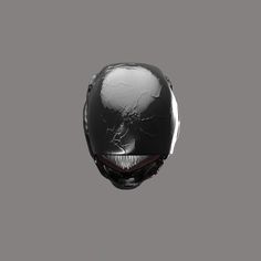 a black and white mask with red eyes on a gray background in the style of an alien