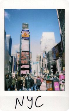 people are walking in the city with tall buildings