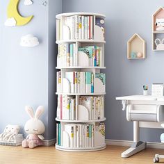 a child's room with bookshelves and toys on the floor in front of it