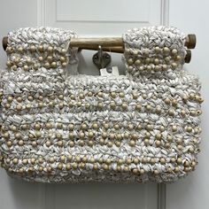 White Crochet With Wood Beads Elegant White Handwoven Bag, White Vacation Bag With Pearl Handle, Elegant Embellished Beach Bag, Elegant Embellished Beach Bags, White Embellished Bag For Everyday Use, Beaded Cream Bag For The Beach, White Beaded Summer Bags, White Beaded Bags For Summer, Summer White Beaded Bags